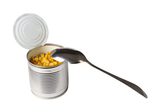 Open can with corn and a spoon