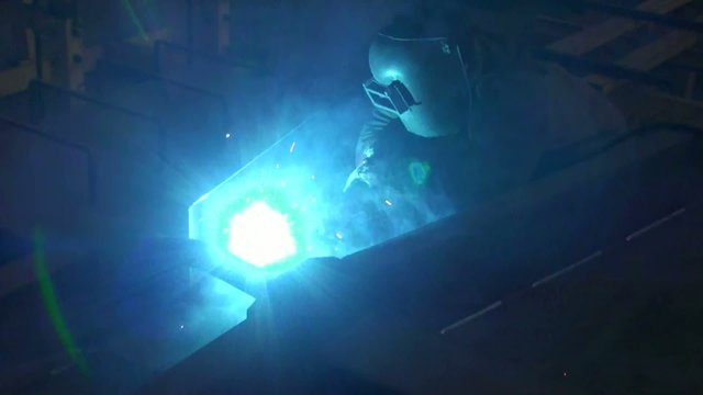 bright blue flashes from welding