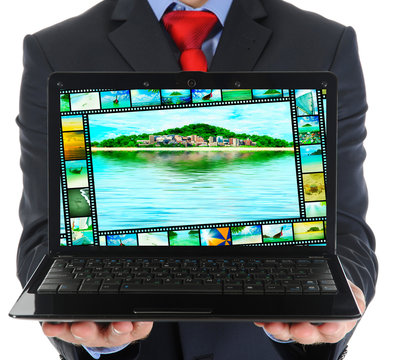 Businessman Holding An Open Laptop