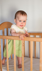 Charming child in the crib