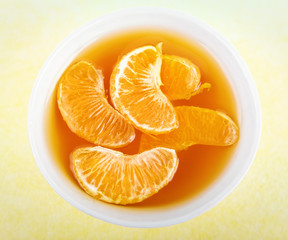 glass of orange jelly dessert with fresh fruits