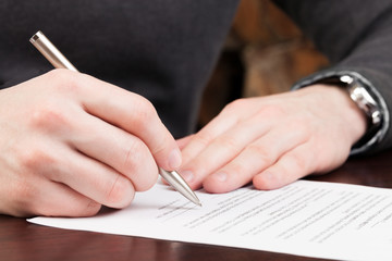 Business men reading contract.