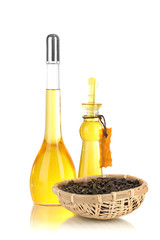 Different types of oil with sunflower seeds isolated on white