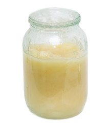 honey in a glass jar on a white background