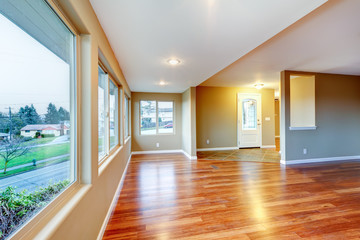 New home empty living room with hardwood floor.