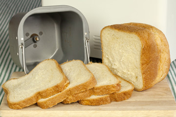Bread machine making fresh bread at home.