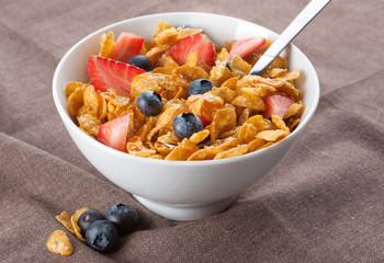 Bowl of corn flakes and berries