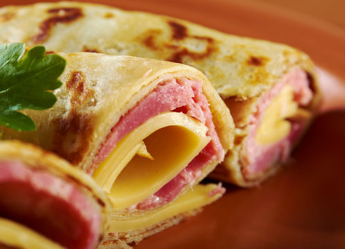 rolled pancakes stuffed ham and cheese.