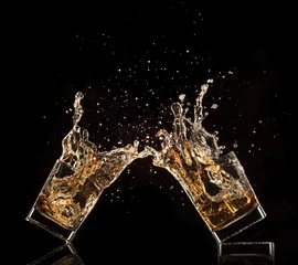 Fotobehang  Glasses of whiskey with splash, isolated on black background © Jag_cz