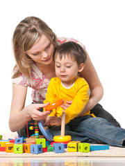 Mother and son on the floor with toys