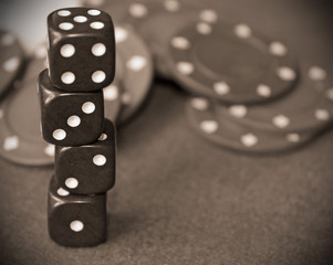 Dice stacked in front of poker chips