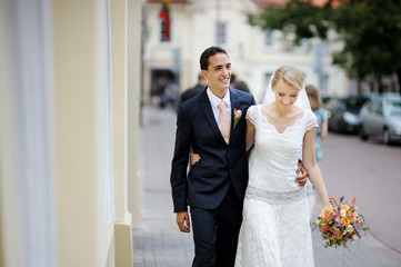 Bride and groom walking together