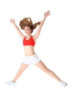young fitness woman jumping isolated over white