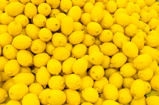 Colorful Display Of Lemons In A Market