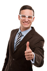 Portrait of a joyful young businessman gesturing thumb up sign o