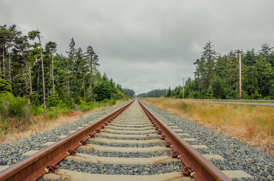 Railway Tracks and Cloudy Sky