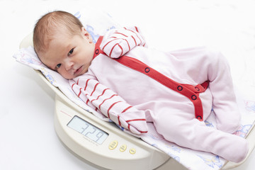 cute baby on the scales