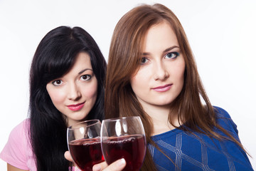 Two pretty cheerful women with glasses of wine