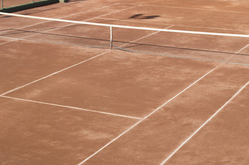 Clay surface tennis court. Dirt surface tennis court