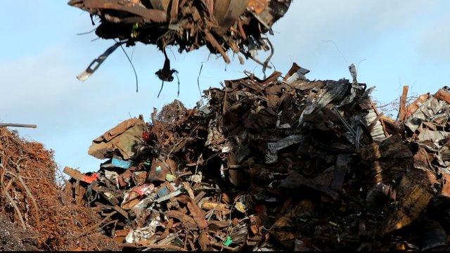 crane grabber working with recycling metal scrap