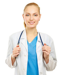 Smiling young doctor in white coat standing