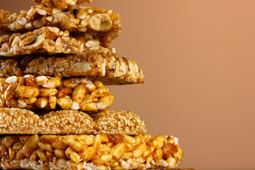 tasty sweets (kozinaki), on brown background