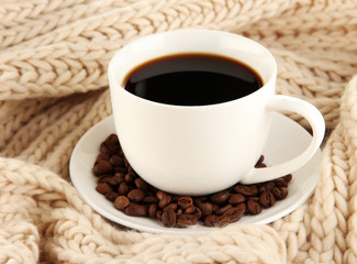 cup of coffee with scarf close-up