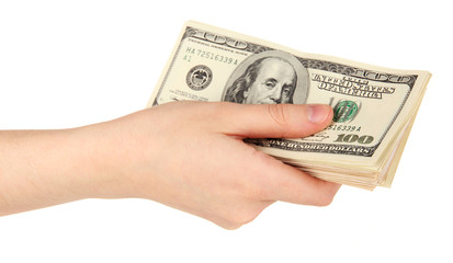 Stack of one hundred dollars banknotes in hand close-up