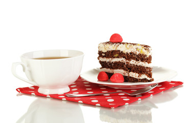 A cup of tea and delicious cake isolated on white