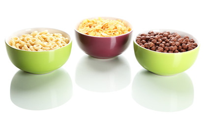Delicious and healthy cereal in bowls isolated on white