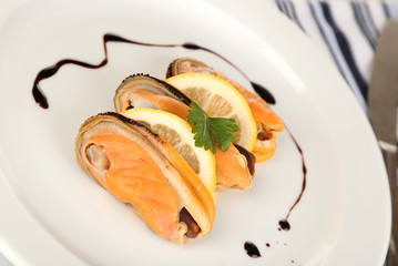Mussels with sauce on plate close-up