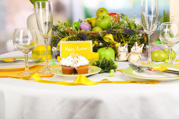 Serving Easter table on room background