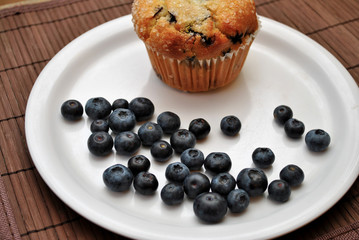 Blueberries with a Muffin in the Background