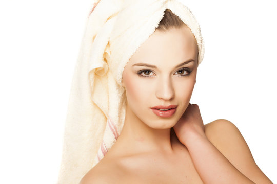 beautiful young woman with a towel on her head after bath