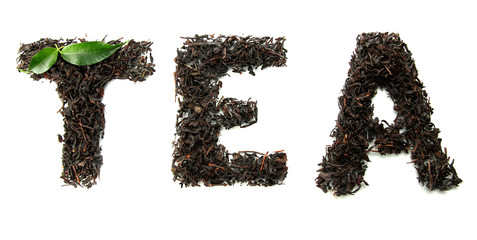 Dry black tea with green leaves, isolated on white