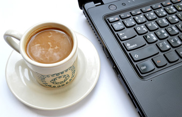 Laptop (notebook) with cup of coffee
