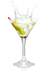 Olive splashing on martini glass isolated on white