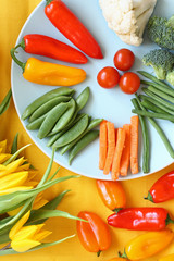 Fresh vegetables on colourful table
