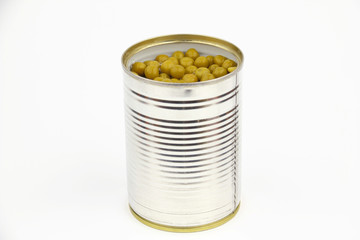 The tin with peas on the white background