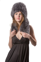 very beautiful woman wearing an black dress with winter fur hat