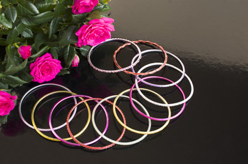 bracelets and bouquet of roses