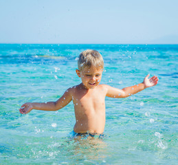 Fototapeta na wymiar Young boy swimming in sea