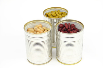 The tins with peas, bean, red bean on the white background