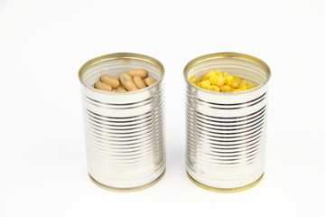 The tins with bean, corn on the white background