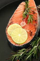 Fresh salmon steak on pan, close up