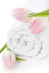 Fototapeta na wymiar Towel and tulips on white