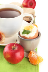 Light breakfast with boiled egg and cup of coffee, isolated