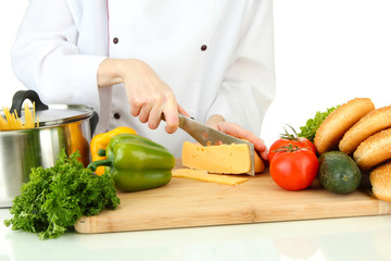 Female hands cutting cheese, isolated on white