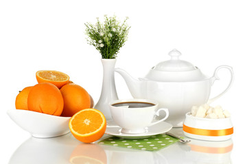 Beautiful white dinner service with oranges isolated on white