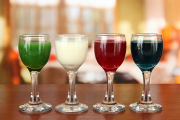 Tasty color liquors, on bright background